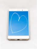Modern smartphone with full screen picture of a heart written in the sky