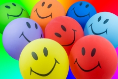 Colorful bunch of smiley balloons