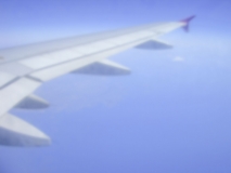 Defocused background of a plane wing during flight