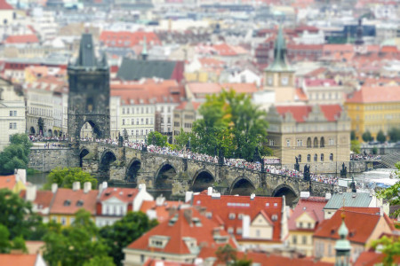 Panoramic view of Prague and city bridges, Czech Republic. Tilt-shift effect applied