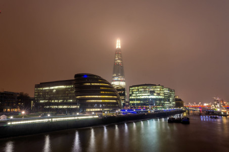 London City skyline at night with the fog, UK