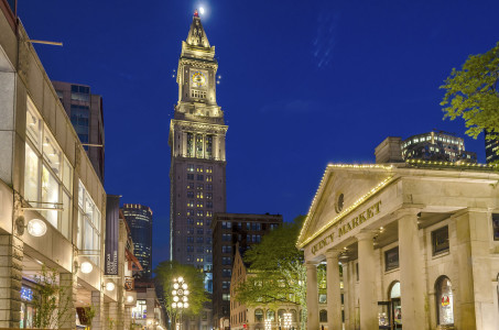 View at night of the Custom House Tower and Quincy Market in central Boston, USA