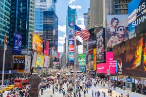 NEW YORK CITY - MAY 26, 2013: Times Square, New York City, May 26, 2013. Times Square is a major commercial intersection in Midtown Manhattan, iconified as "The Crossroads of the World", and hub of the Broadway Theater District