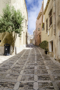 Stone paved ancient medieval street in the town of Erice, Sicily, Italy