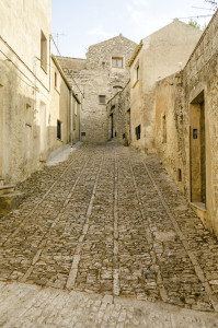 Stone paved ancient medieval street in the town of Erice, Sicily, Italy