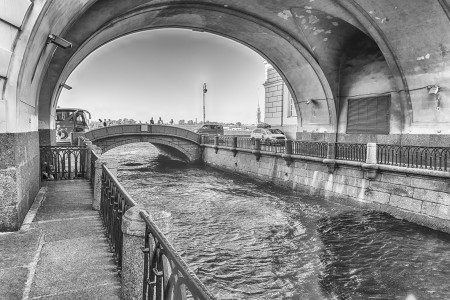 View of Winter Canal with Arch and Hermitage Bridge, scenic landmark in St. Petersburg, Russia