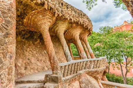 Colonnaded roadway viaduct made with masonry arcades in Park Guell, Barcelona, Catalonia, Spain