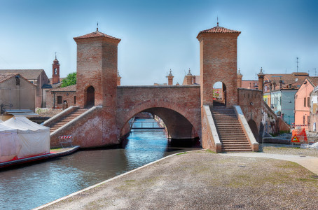 View over the Trepponti Bridge, a masonry arch bridge and iconic landmark in Comacchio, Italy