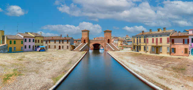 View over the Trepponti Bridge, a masonry arch bridge and iconic landmark in Comacchio, Italy