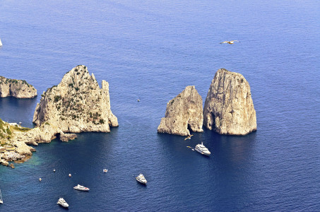 Aerial view of the beautiful Faraglioni rocks, island of Capri, Italy